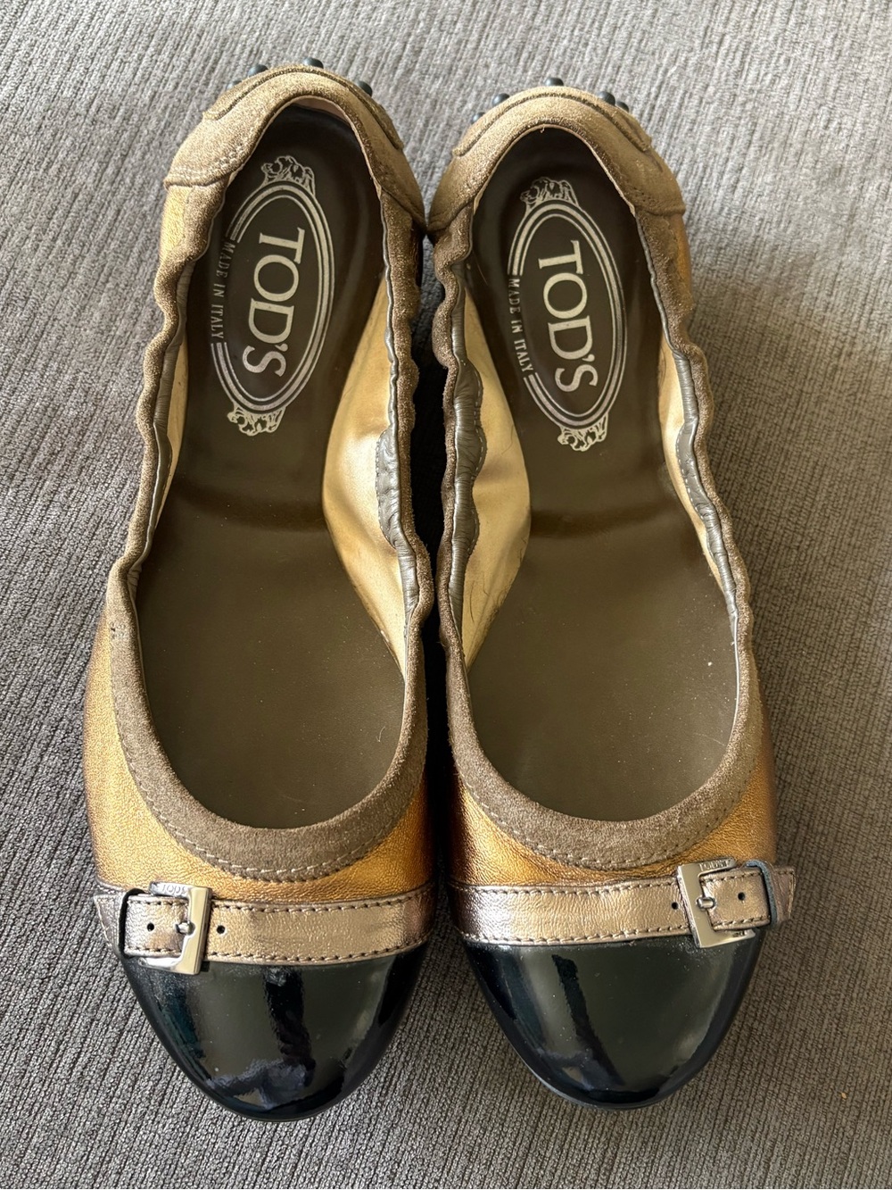 TOD'S Metallic Gold and Black Ballet Flats with Buckle Trim